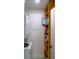 Efficient laundry area features a stacked washer/dryer and handy shelving for storage solutions at 1850 Sunny Dr # F4, Bradenton, FL 34207