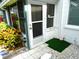 The enclosed patio features a screen door and turf and rock landscaping at 1850 Sunny Dr # F4, Bradenton, FL 34207