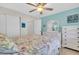 Bedroom with closet, dresser, and light-blue painted wall at 2014 Canal Dr # M6, Bradenton, FL 34207