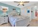 Comfortable bedroom with large bed, decorative lamps, and adjacent bathroom at 2014 Canal Dr # M6, Bradenton, FL 34207