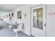 Condo exterior showcasing a cozy seating area and the unit's front door at 2014 Canal Dr # M6, Bradenton, FL 34207