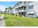 Well-maintained condo buildings with lush landscaping, sidewalk, and multiple lanai at 2014 Canal Dr # M6, Bradenton, FL 34207