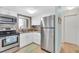 Modern kitchen with stainless steel appliances and white cabinets at 2014 Canal Dr # M6, Bradenton, FL 34207
