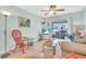 Inviting living room with light walls and sliding glass doors to outdoors at 2014 Canal Dr # M6, Bradenton, FL 34207
