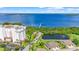High-angle shot of building with water views, lush landscaping, and a beautiful pond at 2417 Fairway Oaks Dr # 22, Palmetto, FL 34221