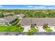 Aerial view of the homes showcasing beautiful landscaping, driveways, and well-kept lawns at 2417 Fairway Oaks Dr # 22, Palmetto, FL 34221