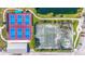 Overhead aerial of the tennis and pickleball courts, with parking and nearby building at 2417 Fairway Oaks Dr # 22, Palmetto, FL 34221