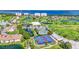 Bird's eye view showcasing tennis courts, a clubhouse, and a beautiful waterfront at 2417 Fairway Oaks Dr # 22, Palmetto, FL 34221