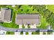 Overhead aerial of townhomes featuring well-manicured landscaping, long driveways and mature trees at 2417 Fairway Oaks Dr # 22, Palmetto, FL 34221