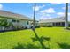 Lush backyard featuring vibrant green grass and mature trees providing ample shade at 2417 Fairway Oaks Dr # 22, Palmetto, FL 34221