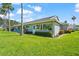 Well-maintained backyard with lush green grass and mature landscaping at 2417 Fairway Oaks Dr # 22, Palmetto, FL 34221