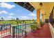 Balcony view overlooking community pool and lush green golf course with sunny skies at 2417 Fairway Oaks Dr # 22, Palmetto, FL 34221