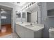 This spacious bathroom has double sinks and an oversized mirror with Hollywood lighting at 2417 Fairway Oaks Dr # 22, Palmetto, FL 34221
