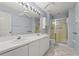 This bathroom offers double sinks, ample counter space, and a glass-enclosed shower at 2417 Fairway Oaks Dr # 22, Palmetto, FL 34221