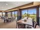 Comfortable dining room with large windows offering views of the golf course and pool at 2417 Fairway Oaks Dr # 22, Palmetto, FL 34221
