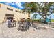 Exterior patio with decorative furniture and landscaping at 2417 Fairway Oaks Dr # 22, Palmetto, FL 34221