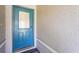 A close-up of a stylish blue front door with decorative glass panel at 2417 Fairway Oaks Dr # 22, Palmetto, FL 34221