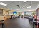 Spacious game room with multiple TVs, a leather sectional, and various seating arrangements at 2417 Fairway Oaks Dr # 22, Palmetto, FL 34221