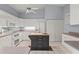 Spacious kitchen with white cabinets, double oven, and island cooktop, perfect for cooking and entertaining at 2417 Fairway Oaks Dr # 22, Palmetto, FL 34221