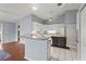 Bright kitchen boasts white cabinets, modern appliances, and a kitchen island at 2417 Fairway Oaks Dr # 22, Palmetto, FL 34221