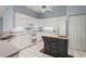 Bright kitchen with white cabinets, modern appliances, and a functional island at 2417 Fairway Oaks Dr # 22, Palmetto, FL 34221