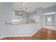 Bright open kitchen featuring white cabinetry and bar seating at 2417 Fairway Oaks Dr # 22, Palmetto, FL 34221