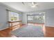 Bright living room includes neutral walls, hardwood flooring and serene backyard views at 2417 Fairway Oaks Dr # 22, Palmetto, FL 34221