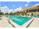 Resort-style pool area with plenty of seating, a nearby building, and a serene ambiance at 2417 Fairway Oaks Dr # 22, Palmetto, FL 34221