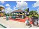 Outdoor bar area with comfortable seating and nearby gas grill by the swimming pool at 2417 Fairway Oaks Dr # 22, Palmetto, FL 34221