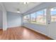 Inviting sunroom with laminate wood flooring, multiple windows offering natural light, and ceiling fans at 2417 Fairway Oaks Dr # 22, Palmetto, FL 34221