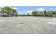 Exterior shot showcasing the condition of the tennis court with view of other tennis courts nearby at 2417 Fairway Oaks Dr # 22, Palmetto, FL 34221