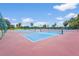 Bright and airy outdoor tennis courts with lush green landscaping, set against a clear blue sky at 2417 Fairway Oaks Dr # 22, Palmetto, FL 34221