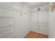 Walk-in closet features wire shelving and wood-look floors at 2417 Fairway Oaks Dr # 22, Palmetto, FL 34221