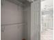 Walk-in closet showing the entrance to a bathroom with glass-enclosed shower at 2417 Fairway Oaks Dr # 22, Palmetto, FL 34221