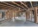 Interior view of a home undergoing renovation, showing exposed wooden beams and studs at 268 Alsace Ave, Venice, FL 34293