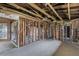 Interior view of a property with exposed framing and ceilings, ready for complete renovation at 268 Alsace Ave, Venice, FL 34293