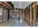 Interior space with exposed framing, concrete floor, and damaged ceiling, under renovation at 268 Alsace Ave, Venice, FL 34293