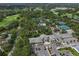 Aerial view of the neighborhood clubhouse, showcasing the property's amenities and landscaping at 3003 Quail Holw # 10, Sarasota, FL 34235