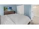 Bright bedroom features a closet and an ensuite bathroom with glass shower at 3003 Quail Holw # 10, Sarasota, FL 34235