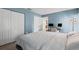 Cozy bedroom features carpet, closet, and a workspace with dual monitors at 3003 Quail Holw # 10, Sarasota, FL 34235