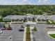 A high angle view of the building's exterior, landscaped grounds, and available parking at 3003 Quail Holw # 10, Sarasota, FL 34235
