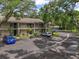 A well maintained, multi-story condo complex featuring balconies and mature trees at 3003 Quail Holw # 10, Sarasota, FL 34235