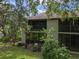Exterior view of the property featuring a blend of natural landscape and classic architecture at 3003 Quail Holw # 10, Sarasota, FL 34235