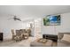 Living area featuring dining space, modern kitchen access, and a comfortable seating arrangement at 3003 Quail Holw # 10, Sarasota, FL 34235