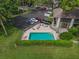 Aerial view of community pool with lounge chairs, providing a relaxing outdoor space at 3003 Quail Holw # 10, Sarasota, FL 34235
