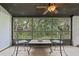 Enjoy outdoor living on screened porch with tile flooring and tranquil views at 3003 Quail Holw # 10, Sarasota, FL 34235
