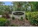 The Meadows Country Club signage with landscaping highlights the Racquet Club entrance at 3003 Quail Holw # 10, Sarasota, FL 34235