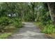 Landscaped walking path in the community, showcasing the natural beauty of the neighborhood at 3003 Quail Holw # 10, Sarasota, FL 34235