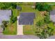 Aerial view of the property showcasing the house, shed, driveway, and expansive backyard at 326 Randolph Rd, Venice, FL 34293