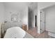 Bathroom showcasing tub, vanity, and closet, perfect for relaxation at 326 Randolph Rd, Venice, FL 34293